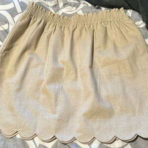 NWT tan skirt by JCrew. Womens size 12. Never worn w/pockets. Lining inside.